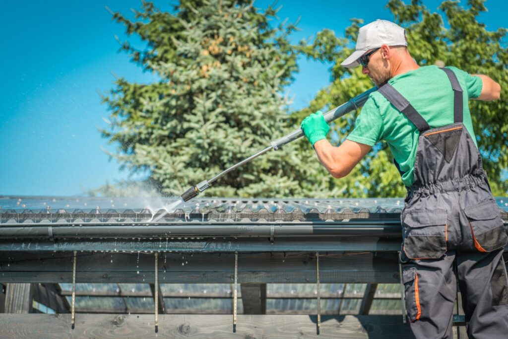 working cleaning house gutter
